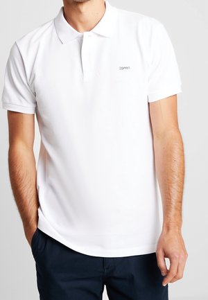 White polo shirt made of smooth cotton, featuring a classic collar, short sleeves, and a small Esprit logo on the left chest.