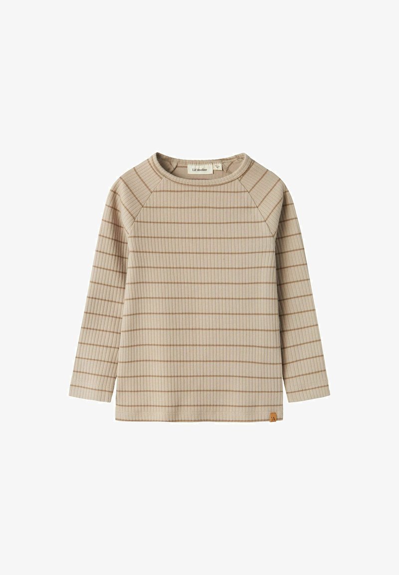 Bézs hosszú ujjú felső bordázott textúrával és vékony barna csíkokkal. Kerek nyakkivágással és raglánujjakkal rendelkezik. Az alsó szegélyén egy feltűnő címke található.