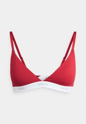 Red triangle bralette with thin straps, featuring a white elastic band with "HUGO" logo. Smooth fabric texture and minimalistic design.