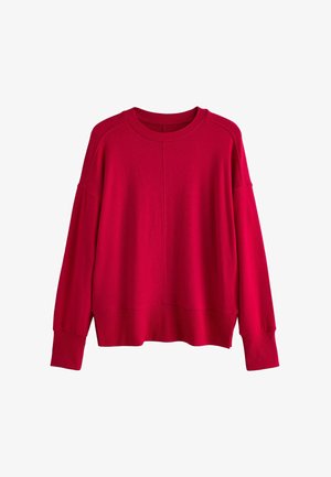 Sarkans adīts džemperis ar apaļu apkakli, kritušām plecu šuvēm un ribotiem aprocēm un apakšmalu. Mīksta tekstūra, brīvs griezums.