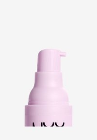 Pink plastic pump bottle with a rounded top and a short nozzle. The design is sleek, featuring a matte finish for texture.