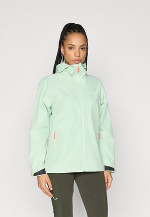 Light mint green jacket with a high collar, zippered pockets, and contrasting orange accents. Made of a smooth, waterproof material.