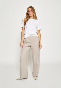 Minus ELVERA MID WAIST  - Hlače - string grey