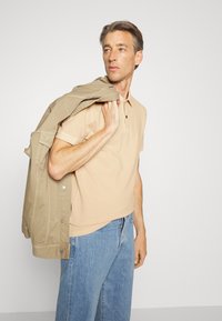 BOSS Polo - light/pastel orange