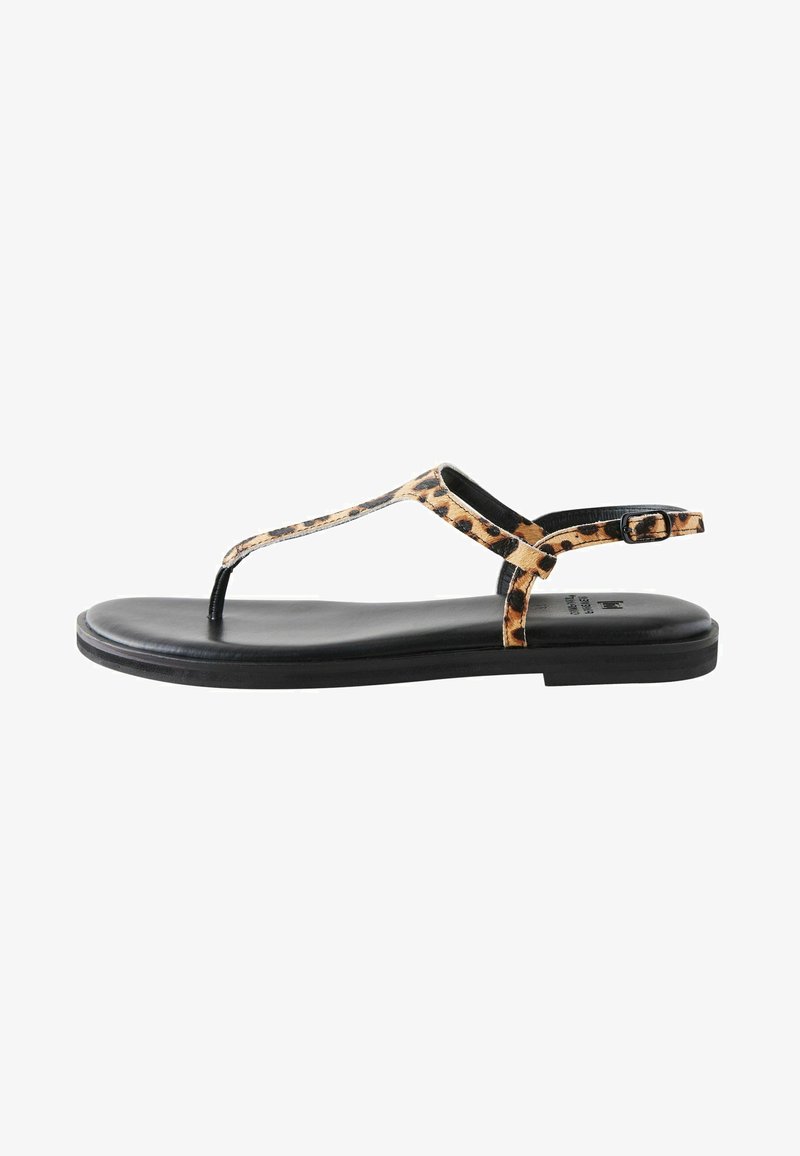 Leopard print thong sandals with a black synthetic sole, featuring a slim strap and adjustable ankle buckle for secure fit.
