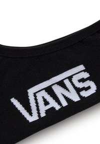 Czarna skarpeta z białym logo "VANS" wyraźnie widocznym. Miękka, dziana faktura i bezszwowy, zaokrąglony design na górze.
