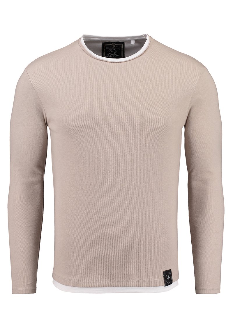 Hellbeige Langarmshirt mit gerippter Textur, Rundhalsausschnitt und kontrastierendem weißen Saum. Verfügt über ein kleines schwarzes Logoetikett am Saum.