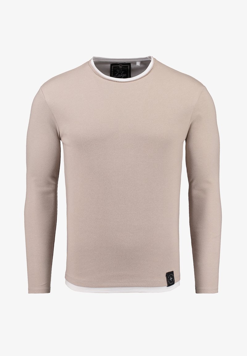 Hellbeige Langarmshirt mit gerippter Textur, Rundhalsausschnitt und kontrastierendem weißen Saum. Verfügt über ein kleines schwarzes Logoetikett am Saum.