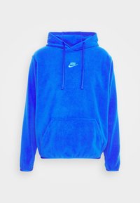 Blue fleece hoodie with a kangaroo pocket, adjustable drawstrings, and white Nike logo on the chest. Soft texture and oversized fit.