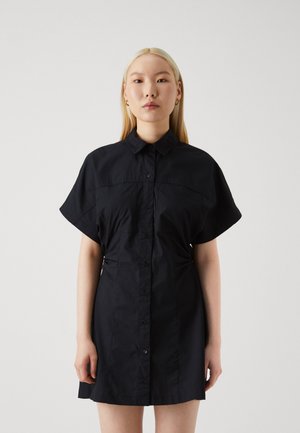 Black button-up dress with short sleeves, collar, and side ruching. Made from lightweight fabric with a smooth texture and sleek design.
