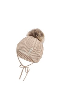 Knit beanie in light beige with a textured design, featuring a fur pom-pom and ties for secure fitting. Branded label on the side.