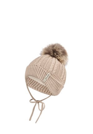 Knit beanie in light beige with a textured design, featuring a fur pom-pom and ties for secure fitting. Branded label on the side.