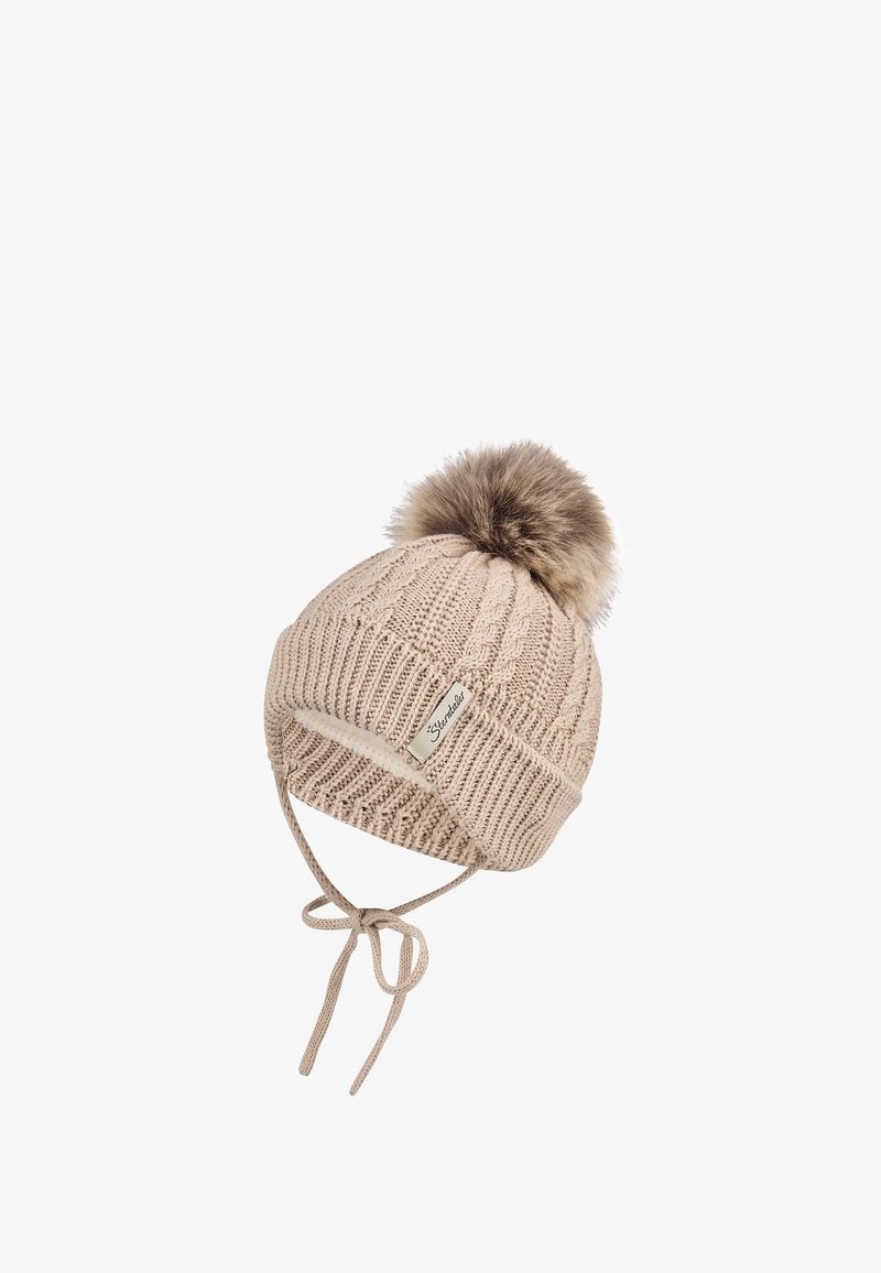 Knit beanie in light beige with a textured design, featuring a fur pom-pom and ties for secure fitting. Branded label on the side.