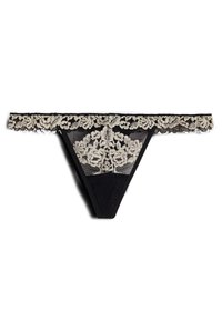 Svart spetstrosa med en bred blomster-lace midjeband och intrikat broderi på frampanelen. Genomskinlig textur med vågiga kanter.