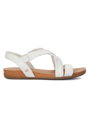 Witte leren slide sandaal met kruislings banden, een tan voering en een gestructureerd oppervlak. Beschikt over een lage wigzool voor comfort.
