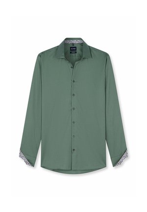 Camicia da uomo verde a manica lunga con bottoni sul davanti, colletto aperto e motivo floreale visibile all'interno dei polsini e del colletto.
