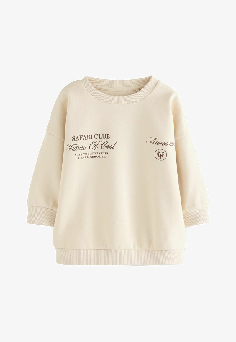Kreemjas värvi sweatshirts laia kaela, langevate õlgadega, soonikkoes mansettide ja prinditud pruunide tekstidega, millel on ringikujuline logo detail.