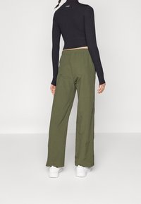 Champion Kalhoty - dark green