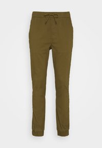 Olijfgroene tapered joggerbroeken met elastische tailleband, trekkoord, zijzakken en elastische boorden bij de enkels.