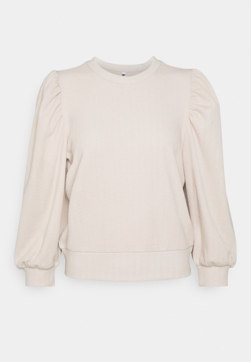 Světle béžový pulovrový svetr s texturovanou látkou, kulatým výstřihem a nafouknutými rukávy s přiléhavými manžetami.