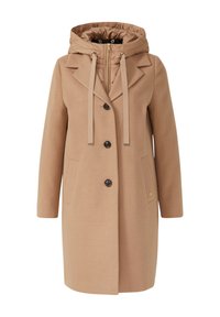 Manteau beige avec une capuche, un col structuré et quatre boutons. Dispose de poches latérales et de cordons en tissu. Fabriqué en matériau doux et lisse.