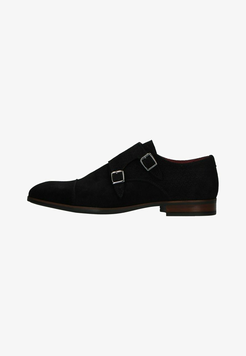 Black suede dress shoe with a sleek silhouette, featuring two silver buckle straps, a curved toe, and a textured upper.