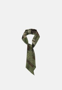Silk scarf in green with a glossy finish, featuring an abstract pattern of shapes and accents in darker tones, tied in a loose knot.