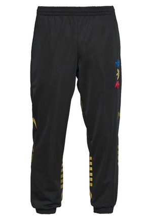 Sorte træningsbukser med elastisk talje og manchetter, med flerfarvede Adidas trefoil-logoer og guld diagonale striber på benene.