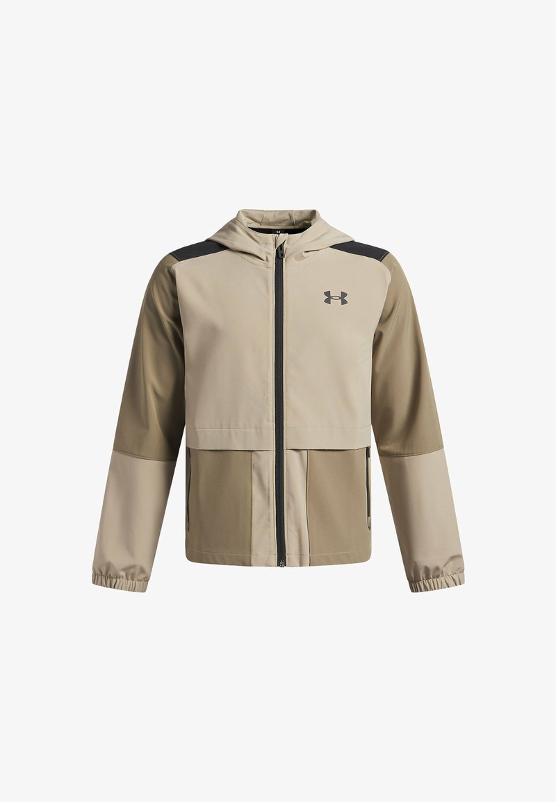 Beige gewatteerde jas met capuchon, zwarte accenten, ritssluiting aan de voorkant, elastische manchetten en twee voorzakken. Gemaakt van lichtgewicht, waterafstotend materiaal.