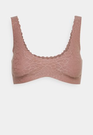 Bralette rosa chiaro con un motivo floreale testurizzato. Bordo scallopato sulle spalline e sulla fascia, design senza cuciture e tessuto elasticizzato.