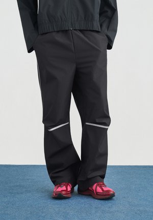 ELUSIVE PANT - Jogginghose - black