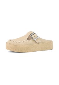 Beige suede clog with a stitched design along the front, a silver buckle on the side, and a textured platform sole.
