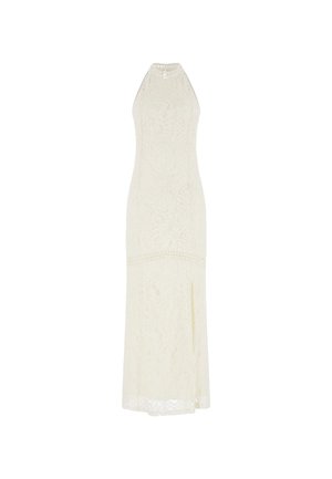 Robe maxi en dentelle crème avec un col halter ajusté et une silhouette longue. Présente des motifs de feuilles et une fente sur le côté pour plus de détails.