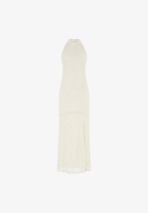 Pitkä pitsimekko kerma väriä, jossa on istuva halkioolkaiminen malli ja pitkä siluetti. Ominaisuuksiin kuuluu lehtikuviot ja sivuhalkio lisäyksinä.