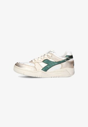 White and metallic gold sneaker with green accents, smooth and textured surfaces, perforated toe, padded tongue, and a rubber sole.