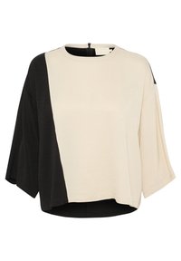 Tunique asymétrique avec des blocs de couleurs noir et beige, encolure ronde et manches courtes larges, avec un détail de fermeture éclair à l'arrière.