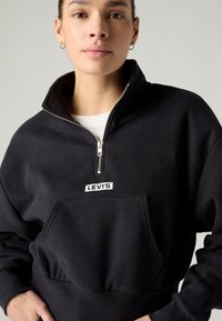 Levi's® GRAPHIC SARA 1/4 ZIP - Melegítőfelső - black