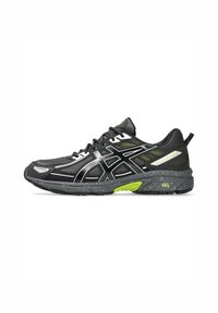 Black running shoe with a mesh upper, reflective silver accents, green highlights, and a speckled gray outsole; features GEL cushioning technology.