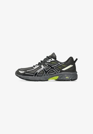 Black running shoe with a mesh upper, reflective silver accents, green highlights, and a speckled gray outsole; features GEL cushioning technology.