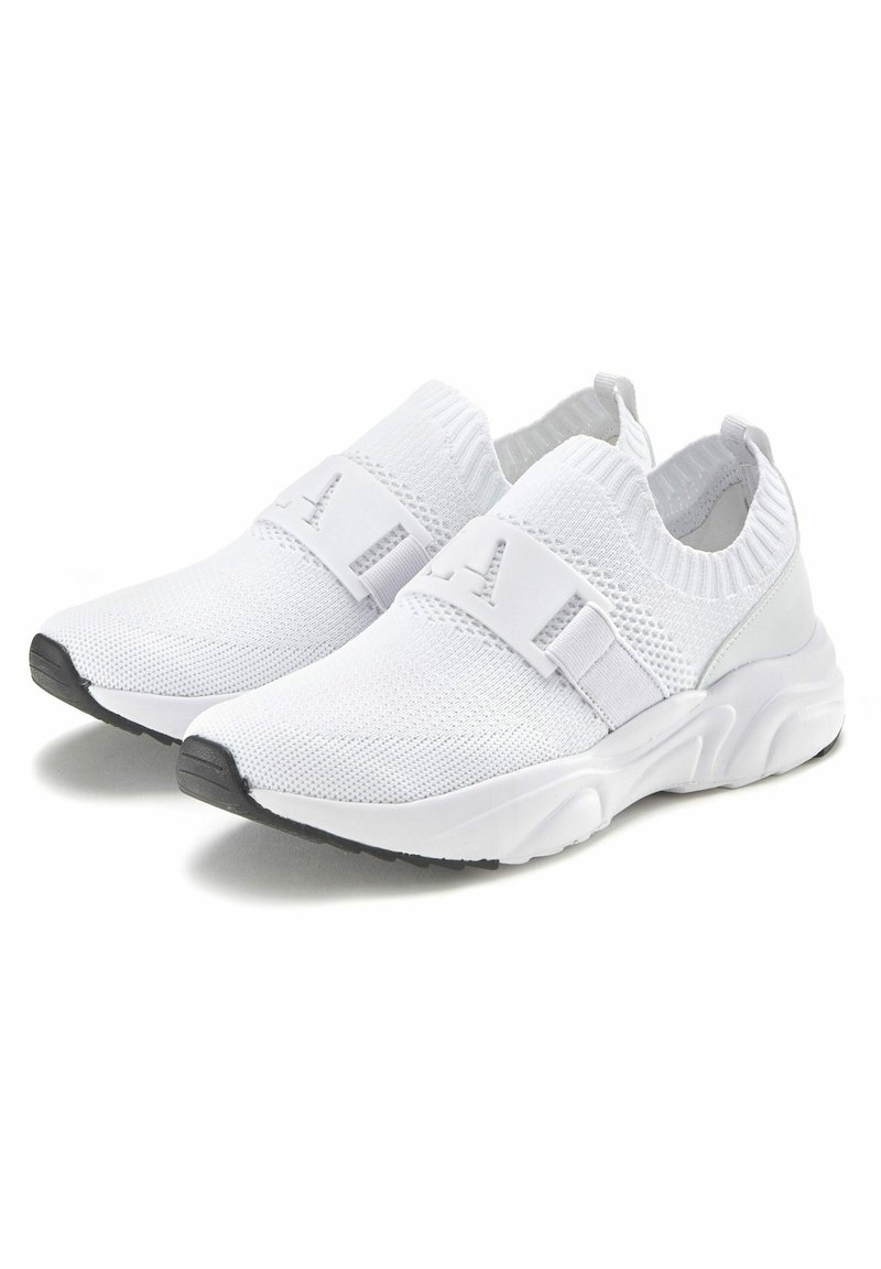 White stretch-knit sneakers with elastic strap closure, round toe, textured upper, and grey accents on the heel and sole.