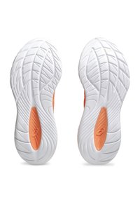 White athletic shoe soles with textured patterns, featuring an orange accent on the heel. Lightweight design for flexibility and traction.