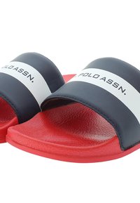 Marinblåa sandaletter med vita ränder och logodetalj, med en strukturerad röd sula och ett slätt ovandela.