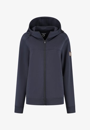 Marineblauwe ritsvest met verstelbare trekkoordkap, ribgebreide manchetten en zoom, en een patchlogo op de linkermouw.