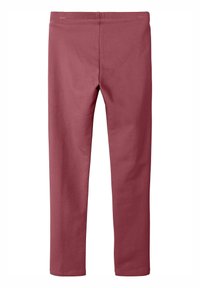 Leggings bordeaux fabriqués en tissu doux et extensible. Présentent une taille lisse et un ajustement confortable. Design simple sans motifs ni matériel apparent.