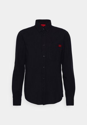 Black long-sleeve button-up shirt made of smooth fabric, featuring a chest pocket and a small red logo on the left side.