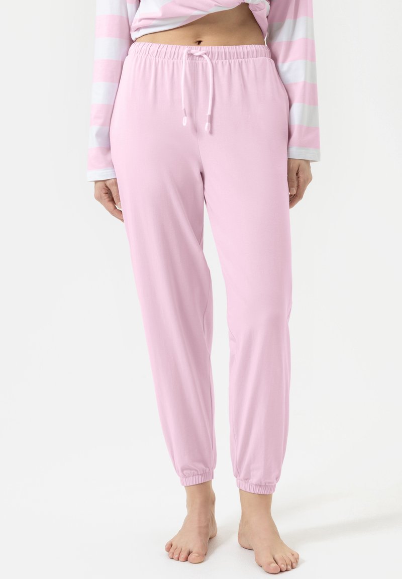 Zachtroze joggingsbroek van zachte stof met een elastische tailleband, verstelbare trekkoord en ribgebreide boorden bij de enkels.