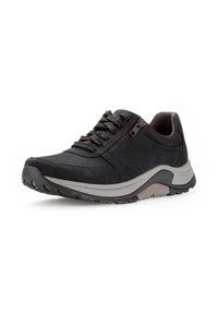 Schwarzer sportlicher Schuh aus Wildleder mit strukturiertem Finish, ausgestattet mit einer Schnürung an der Vorderseite, einem Reißverschluss an der Seite und einer stabilen Gummisohle mit grauen Akzenten.