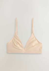 Pehme beige langaton rintaliivit, joissa ohuet säädettävät hihnat ja kolmionmuotoiset kupit, asetettuna tasaisesti vaalealle taustalle.