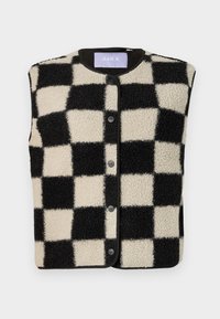 Gilet in pile a scacchi neri e crema con scollo rotondo, bottoni a pressione frontali e bordo in contrasto lungo i lati.