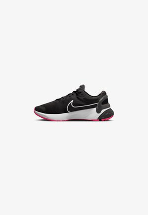 Black and white Nike running shoe with pink sole accents, mesh upper, and cushioning heel support shown from the side on a white background.